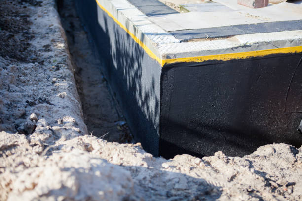 Professional Basement Waterproofing technician working in Bunker Hill, IL
